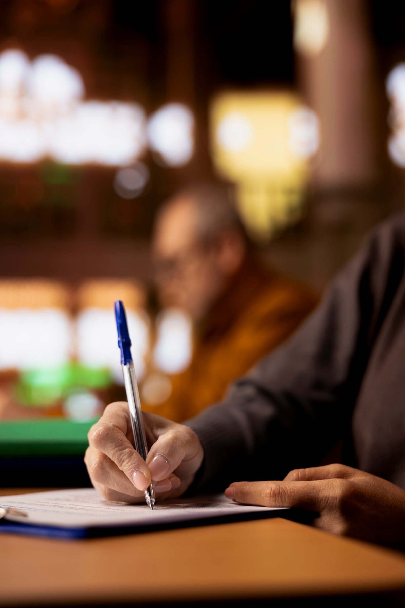 mature academic person prepares documents for her university coursework